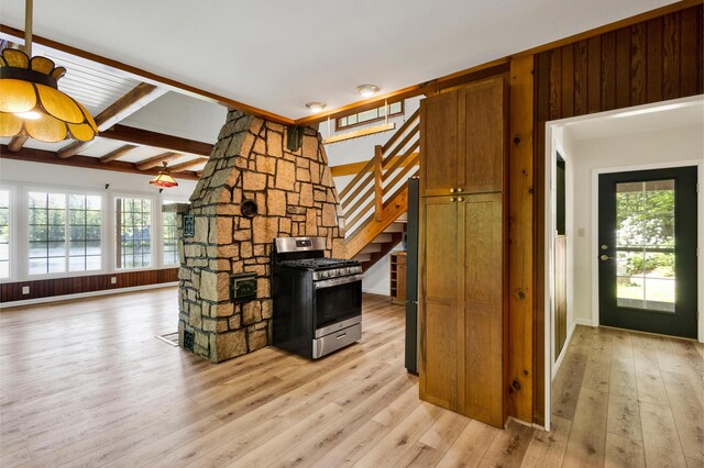30 Otter Cove Ln, North Berwick, ME 03906 - unfurnished living room with plenty of natural light, stairway, and light wood-style flooring
