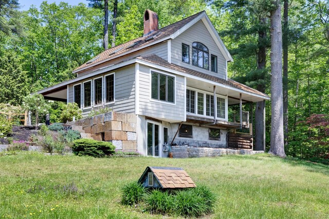 30 Otter Cove Ln, North Berwick, ME 03906 - back of house with a chimney and a lawn