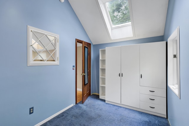 30 Otter Cove Ln, North Berwick, ME 03906 - unfurnished bedroom featuring carpet, a skylight, vaulted ceiling, a closet, and baseboards