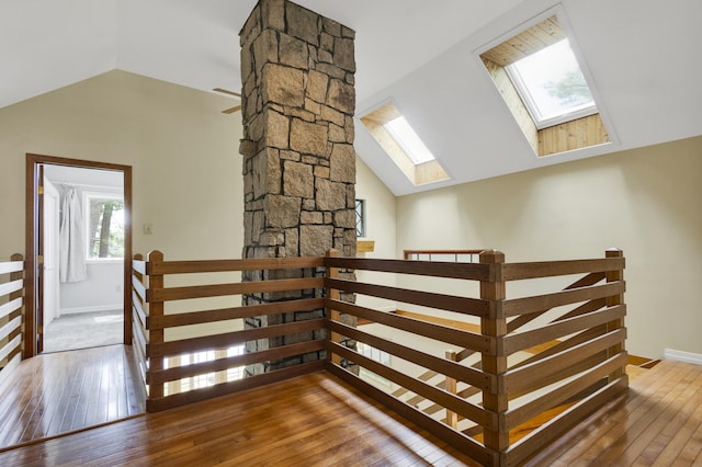 30 Otter Cove Ln, North Berwick, ME 03906 - stairway featuring vaulted ceiling, a skylight, hardwood / wood-style floors, and baseboards