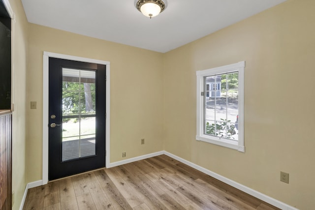 30 Otter Cove Ln, North Berwick, ME 03906 - doorway to outside featuring light wood-style floors and baseboards