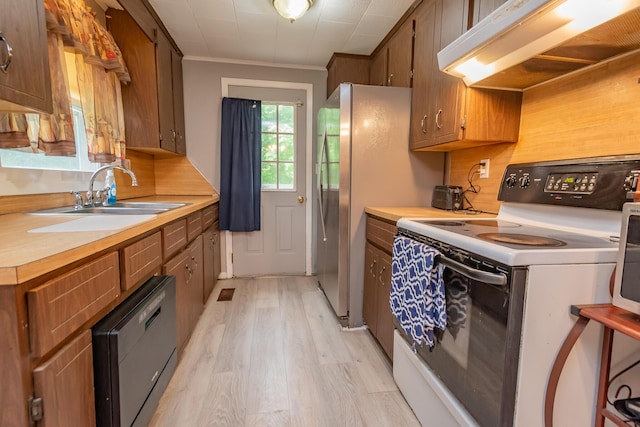 26 Knapp Ave, Milo, ME 04463 - kitchen featuring white electric range, exhaust hood, a sink, light wood-style floors, and light countertops