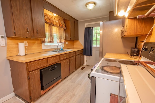 26 Knapp Ave, Milo, ME 04463 - kitchen featuring white range with electric cooktop, a sink, light wood-style floors, light countertops, and brown cabinets