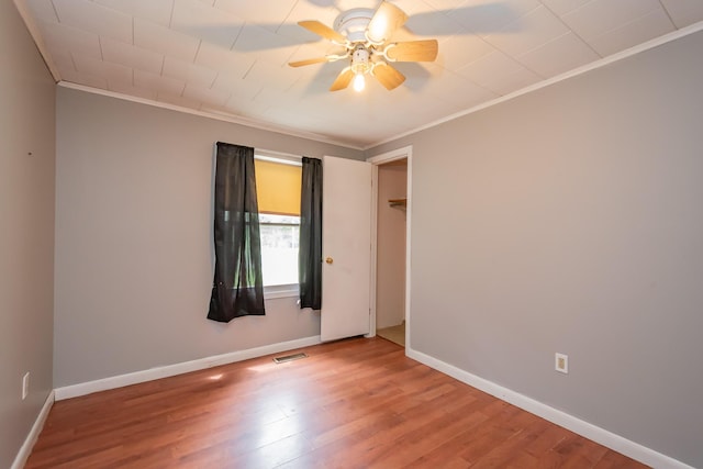 26 Knapp Ave, Milo, ME 04463 - empty room featuring ornamental molding, wood finished floors, baseboards, and a ceiling fan