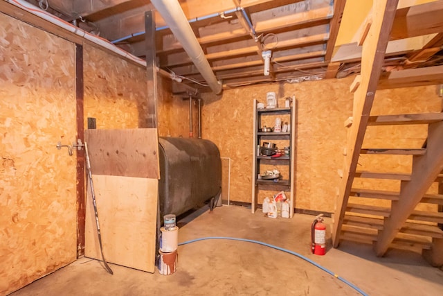 26 Knapp Ave, Milo, ME 04463 - unfinished basement with oil tank and stairs