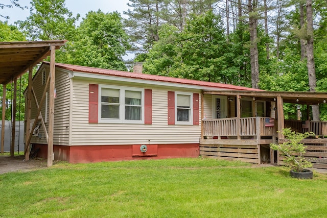26 Knapp Ave, Milo, ME 04463 - view of front of house with a front yard and metal roof