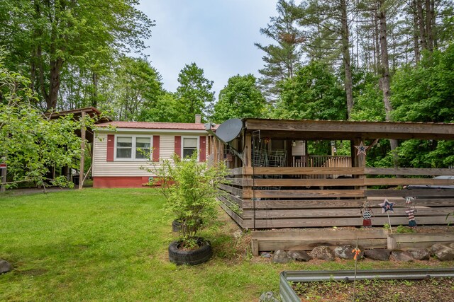 26 Knapp Ave, Milo, ME 04463 - rear view of house with metal roof