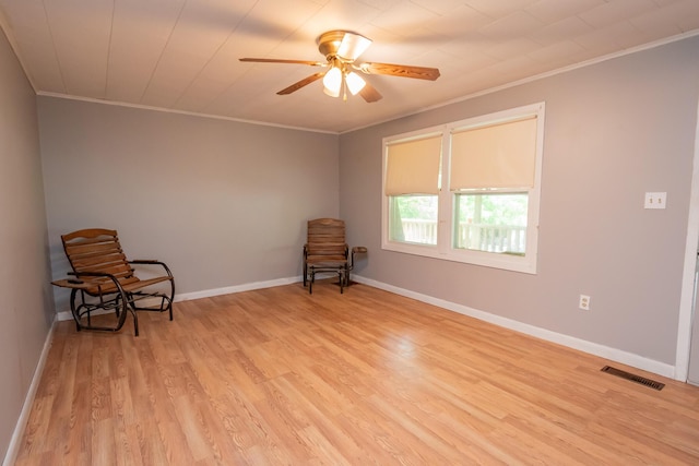 26 Knapp Ave, Milo, ME 04463 - unfurnished room featuring crown molding, light wood finished floors, a ceiling fan, and baseboards