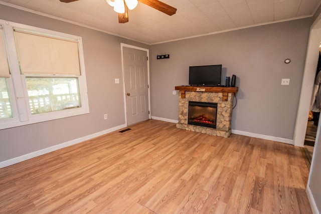 26 Knapp Ave, Milo, ME 04463 - unfurnished living room featuring ceiling fan, ornamental molding, light wood finished floors, a fireplace, and baseboards