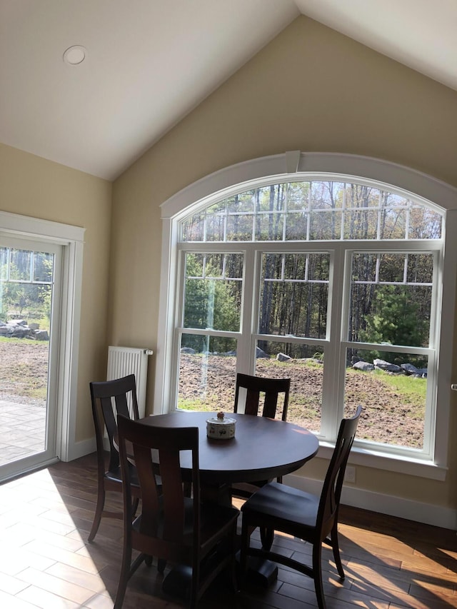 9 Atkinson Ln, Saco, ME 04072 - dining room featuring vaulted ceiling, wood finished floors, and baseboards