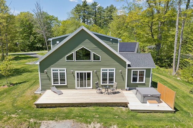 29 Bay Field Dr, Woolwich, ME 04579 - back of property featuring a yard, roof mounted solar panels, roof with shingles, and a wooden deck