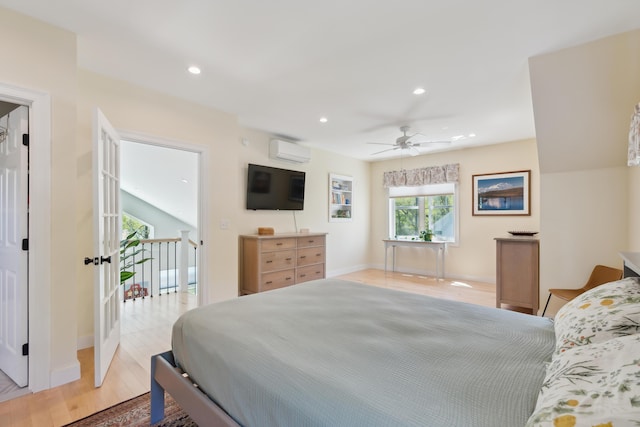 29 Bay Field Dr, Woolwich, ME 04579 - bedroom featuring a wall unit AC, light wood-type flooring, and recessed lighting