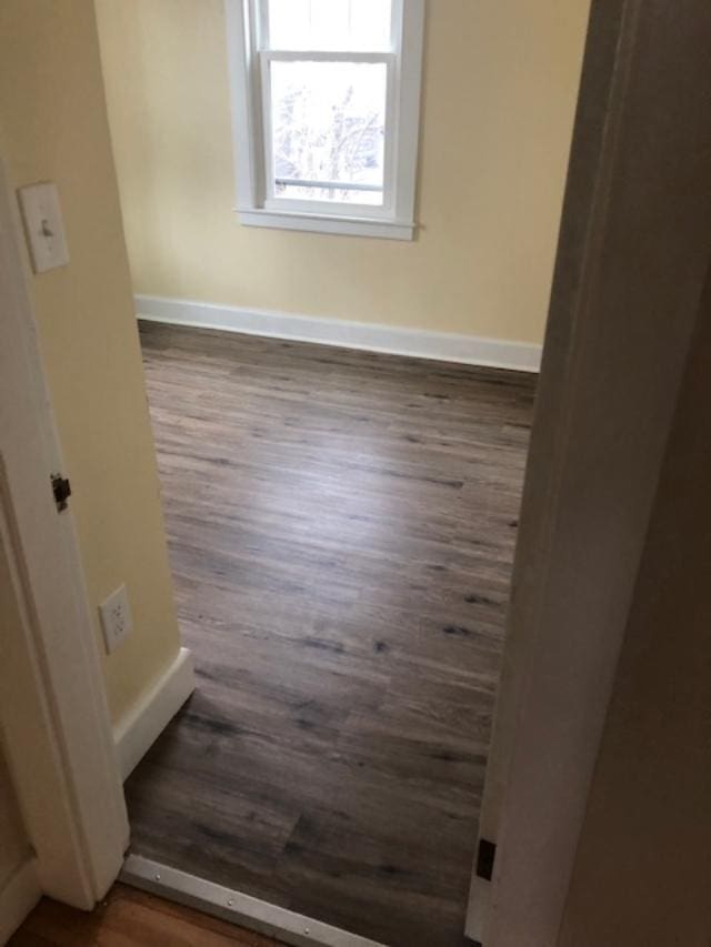 29 13th St, Bangor, ME 04401 - empty room featuring wood finished floors and baseboards