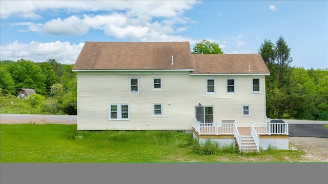 32 Skillings Corner Rd, Auburn, ME 04210 - back of house featuring a deck and a yard