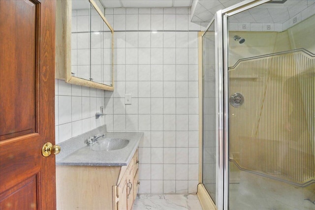 32 Skillings Corner Rd, Auburn, ME 04210 - full bath with a stall shower, vanity, tile walls, and marble finish flooring