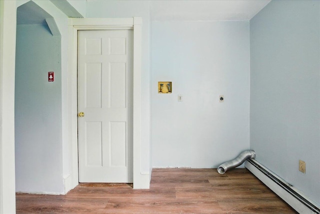 32 Skillings Corner Rd, Auburn, ME 04210 - laundry room featuring baseboard heating, electric dryer hookup, wood finished floors, washer hookup, and arched walkways