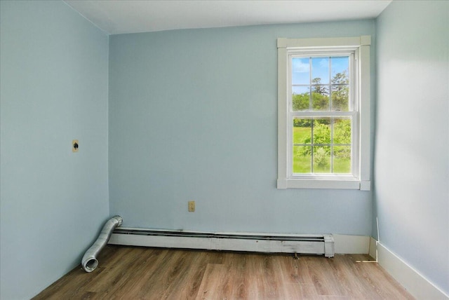 32 Skillings Corner Rd, Auburn, ME 04210 - spare room with a baseboard radiator, healthy amount of natural light, wood finished floors, and baseboards