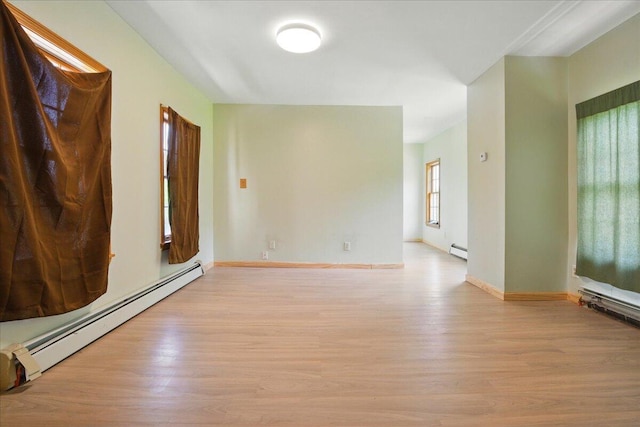 32 Skillings Corner Rd, Auburn, ME 04210 - empty room featuring a baseboard radiator, light wood finished floors, and baseboards