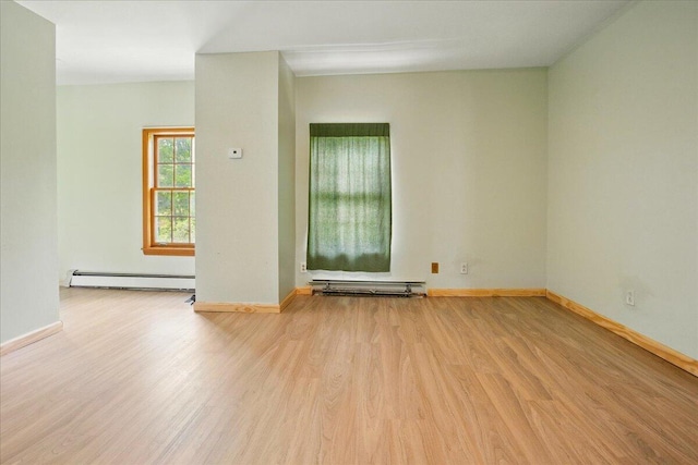 32 Skillings Corner Rd, Auburn, ME 04210 - spare room featuring light wood-style flooring, a baseboard heating unit, and baseboards