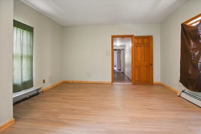 32 Skillings Corner Rd, Auburn, ME 04210 - unfurnished living room with light wood-style flooring, baseboards, and baseboard heating