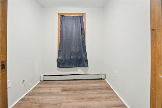 32 Skillings Corner Rd, Auburn, ME 04210 - unfurnished room with a baseboard heating unit, wood finished floors, and baseboards