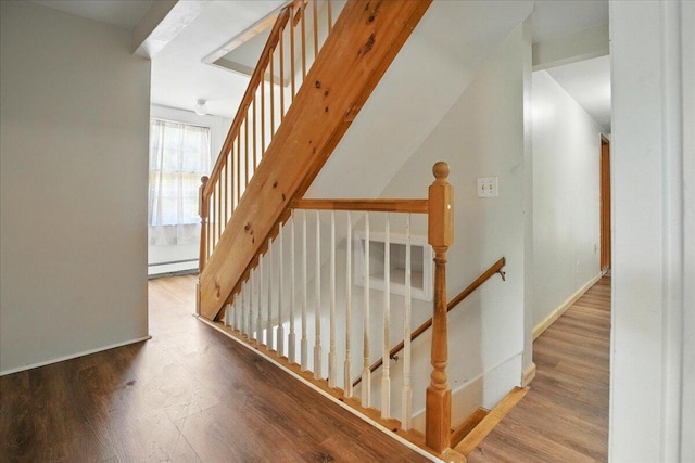32 Skillings Corner Rd, Auburn, ME 04210 - stairs with a baseboard radiator, wood finished floors, and baseboards