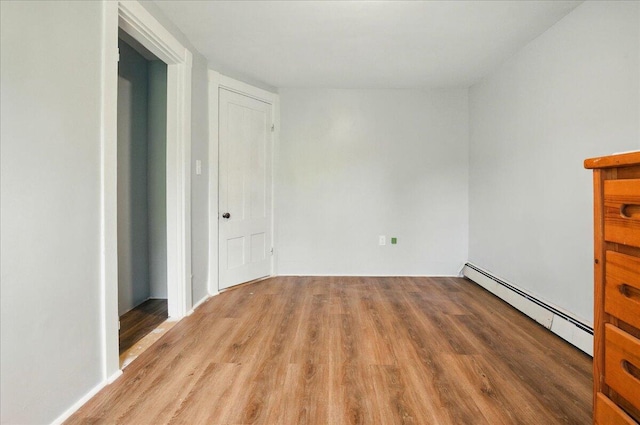 32 Skillings Corner Rd, Auburn, ME 04210 - unfurnished bedroom with baseboard heating and wood finished floors