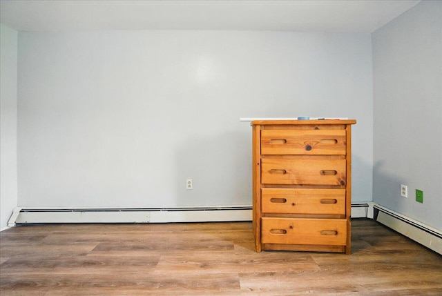 32 Skillings Corner Rd, Auburn, ME 04210 - unfurnished room with wood finished floors and a baseboard heating unit