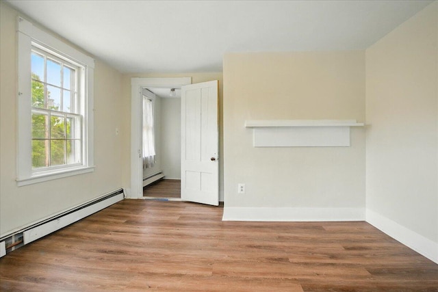 32 Skillings Corner Rd, Auburn, ME 04210 - spare room with baseboard heating, wood finished floors, and baseboards