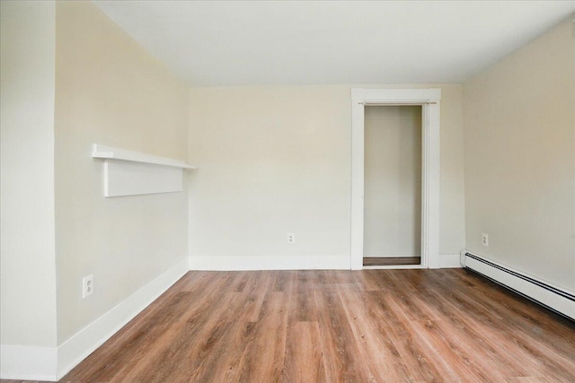 32 Skillings Corner Rd, Auburn, ME 04210 - unfurnished room with wood finished floors, baseboard heating, and baseboards