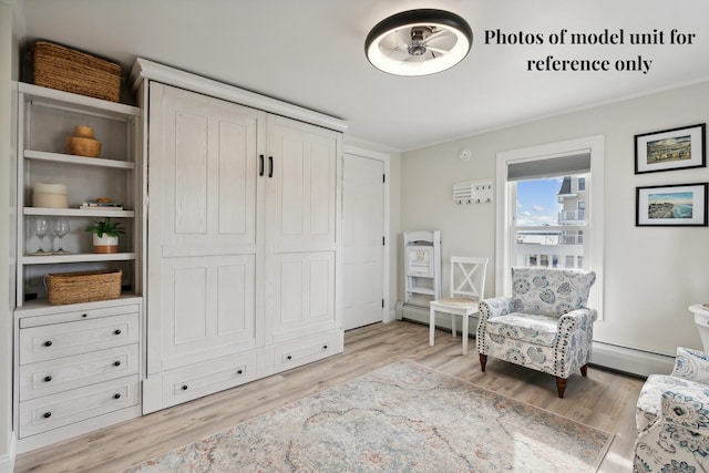 5 Kinney Ave Unit 302, Old Orchard Beach, ME 04064 - sitting room with light wood-style flooring and baseboard heating