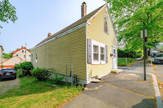 13 Monroe St, Portland, ME 04101 - view of home's exterior featuring a chimney