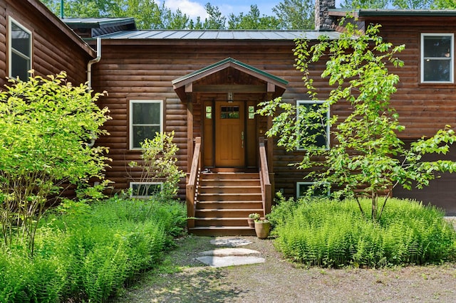 21 Jones Dr, Hartford, ME 04220 - doorway to property featuring a chimney