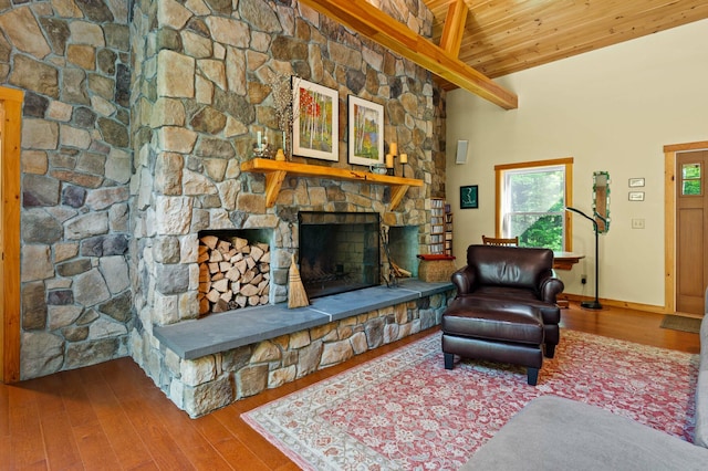21 Jones Dr, Hartford, ME 04220 - living room featuring a wooden ceiling with exposed beams, wood finished floors, and a stone fireplace