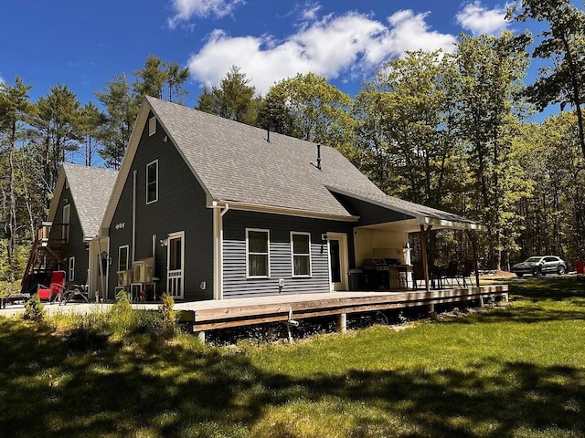 9 Springer Ln, Morrill, ME 04952 - back of property with roof with shingles, a wooden deck, and a yard