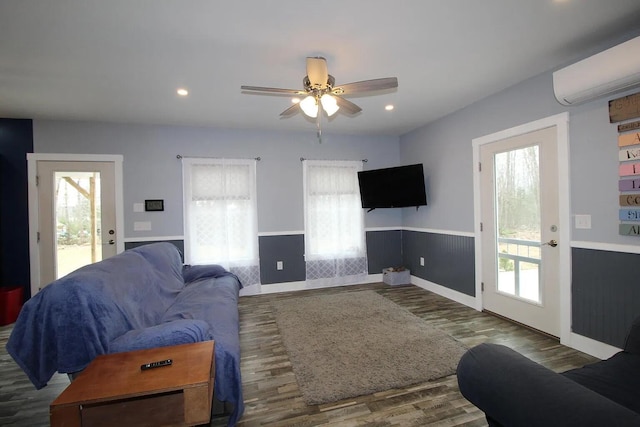 9 Springer Ln, Morrill, ME 04952 - living room featuring a wall mounted AC, healthy amount of natural light, wood finished floors, and recessed lighting