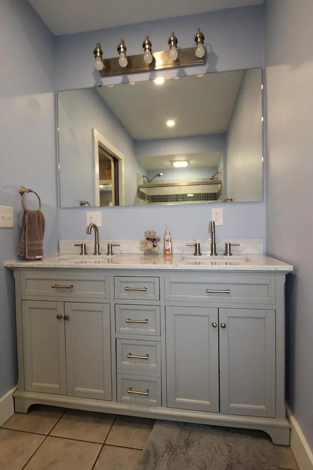9 Springer Ln, Morrill, ME 04952 - bathroom featuring tile patterned floors, baseboards, and double vanity