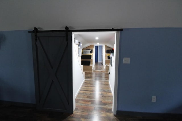 9 Springer Ln, Morrill, ME 04952 - hall featuring dark wood finished floors, lofted ceiling, baseboards, and a barn door