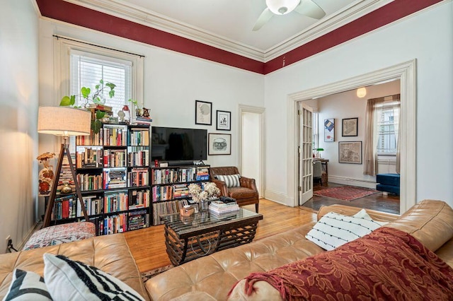 130 Emery St, Portland, ME 04102 - living area featuring plenty of natural light, ornamental molding, wood finished floors, ceiling fan, and baseboard heating