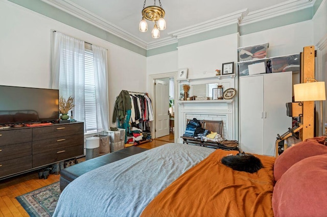 130 Emery St, Portland, ME 04102 - bedroom featuring ornamental molding and hardwood / wood-style flooring