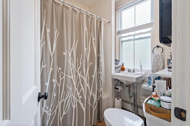 130 Emery St, Portland, ME 04102 - bathroom with shower / tub combo with curtain and a baseboard radiator