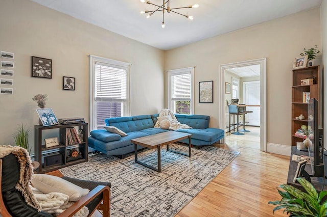 130 Emery St, Portland, ME 04102 - living room featuring a chandelier and light wood-style flooring