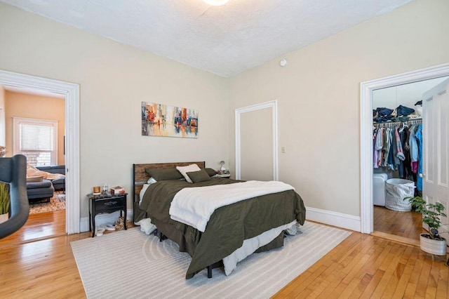 130 Emery St, Portland, ME 04102 - bedroom with light wood-type flooring, a spacious closet, and a closet