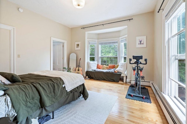 130 Emery St, Portland, ME 04102 - bedroom featuring wood-type flooring and baseboard heating