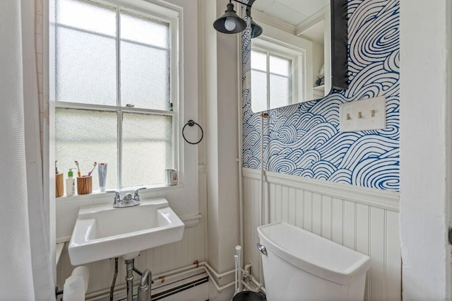 130 Emery St, Portland, ME 04102 - bathroom featuring a wainscoted wall and a decorative wall