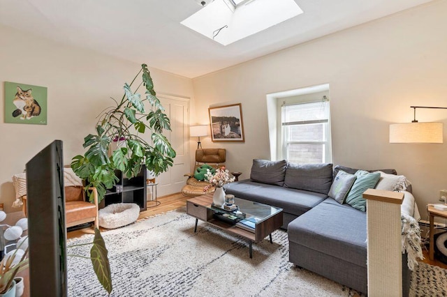 130 Emery St, Portland, ME 04102 - living room featuring a skylight and wood finished floors