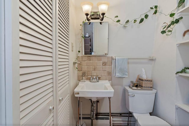 130 Emery St, Portland, ME 04102 - bathroom featuring decorative backsplash and a closet