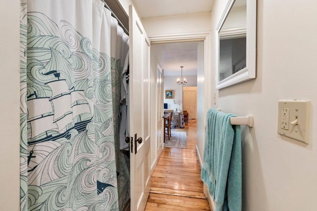 130 Emery St, Portland, ME 04102 - corridor with light wood-style floors and a chandelier