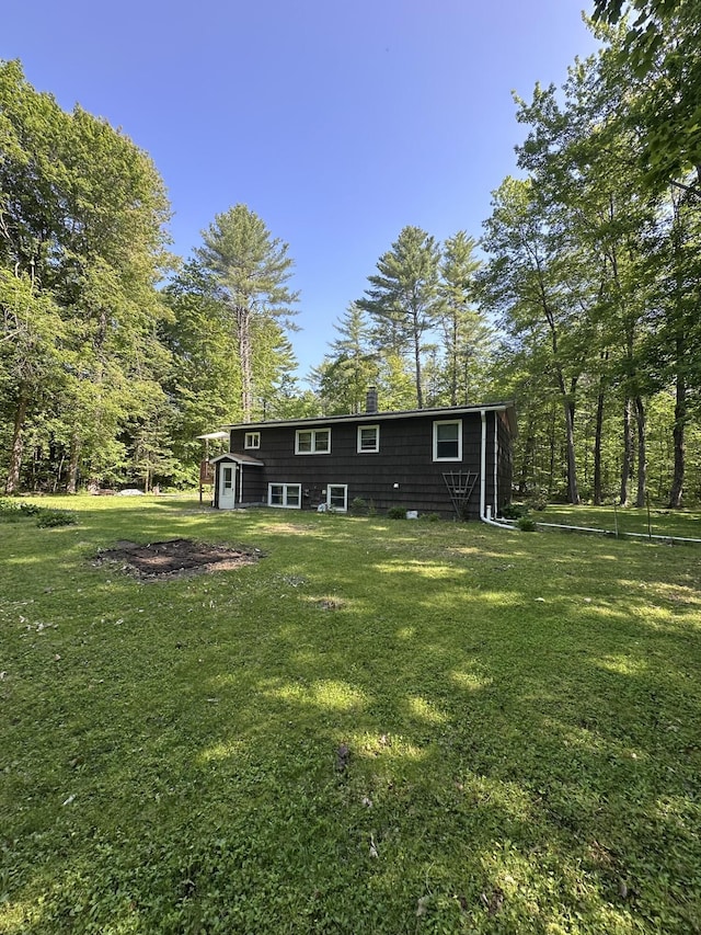 15 Balsam Ln, Naples, ME 04055 - back of property featuring a yard and an outbuilding