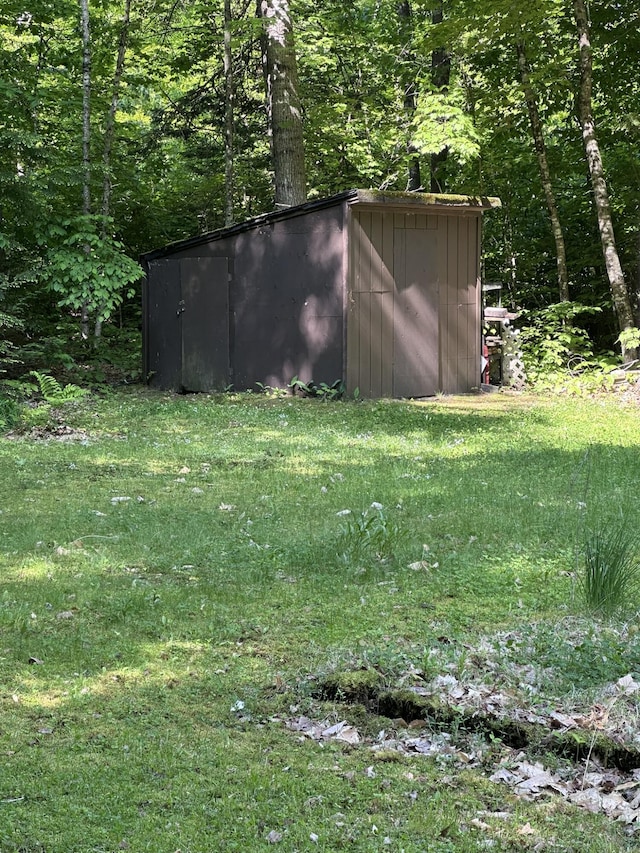 15 Balsam Ln, Naples, ME 04055 - view of yard featuring a view of trees and an outdoor structure